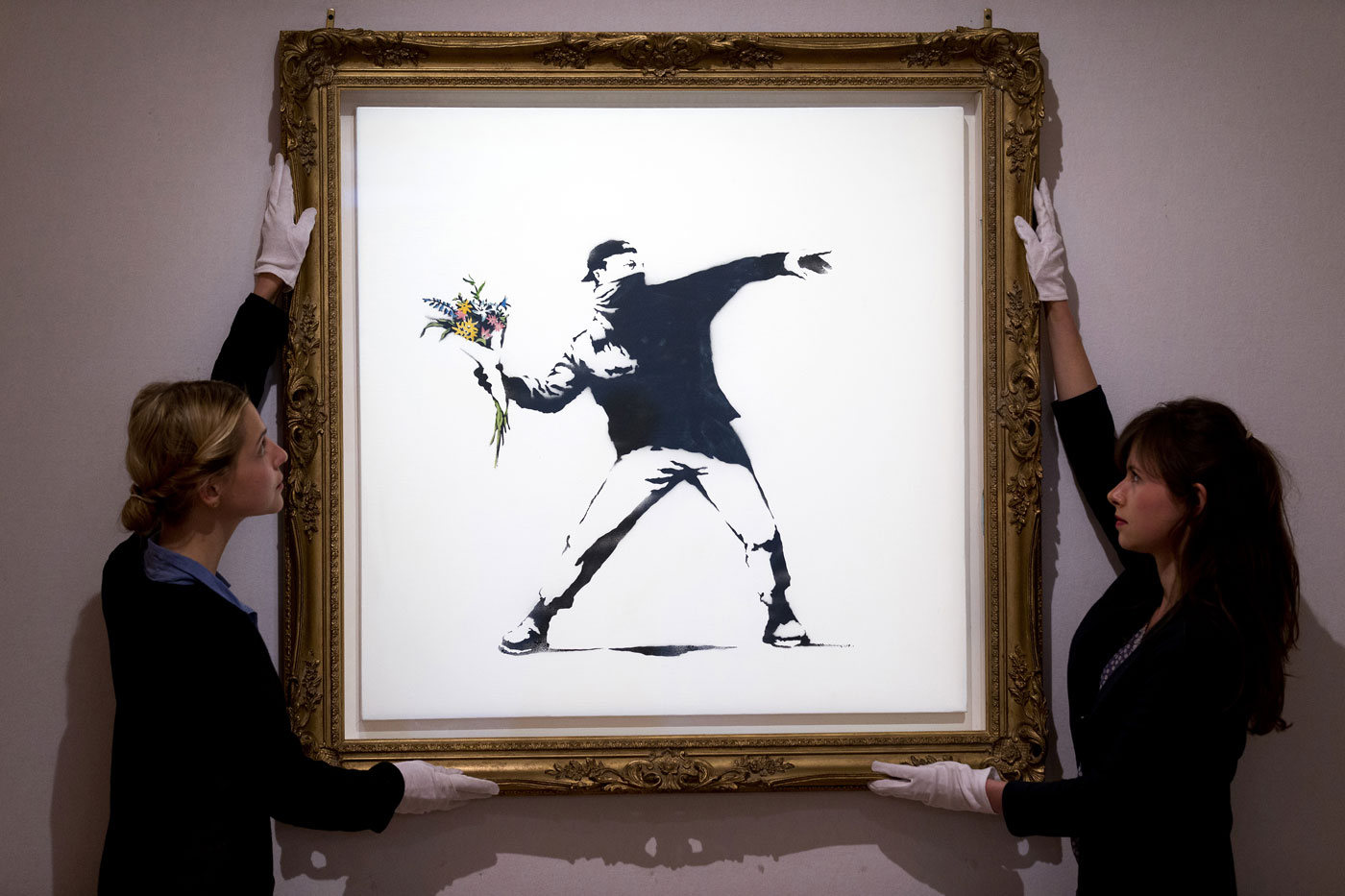 Banksy Love Is in the Air Soid 10,000 NFTS non fungible tokens cryptocurrency digital art sothebys painting christies particle art