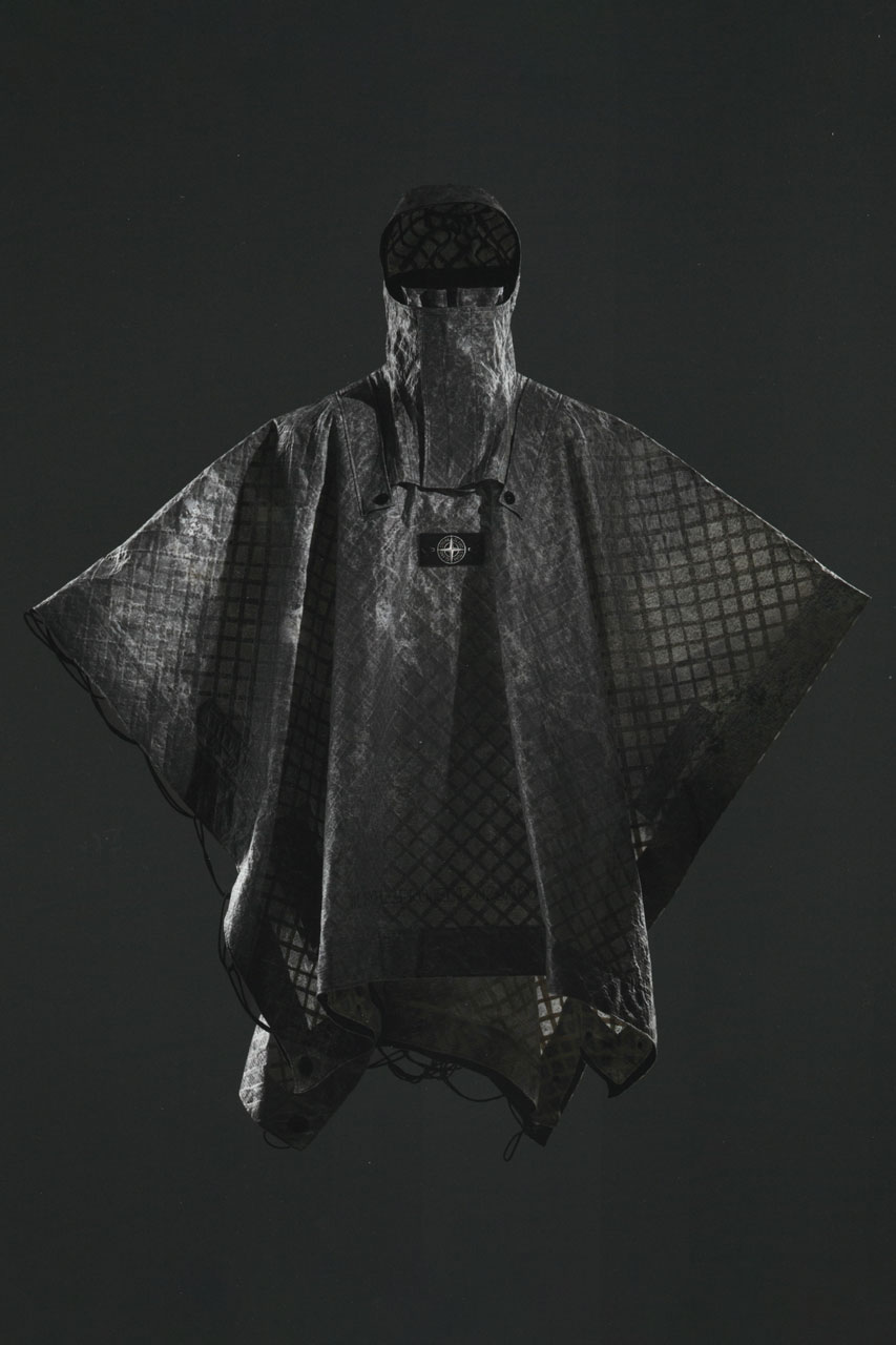 Stone Island Presents Military-Inspired Cape for Prototype Research Series_08 milan design week on display capsule collection design experimental label fabric multiaxial linen textile base as a natural reinforcement material, subsequent needle-cohesion to a non-woven fabric veil, state-of-the-art inkjet printing with pigments and double lamination of aliphatic polyurethane film. garments clothing fashion 