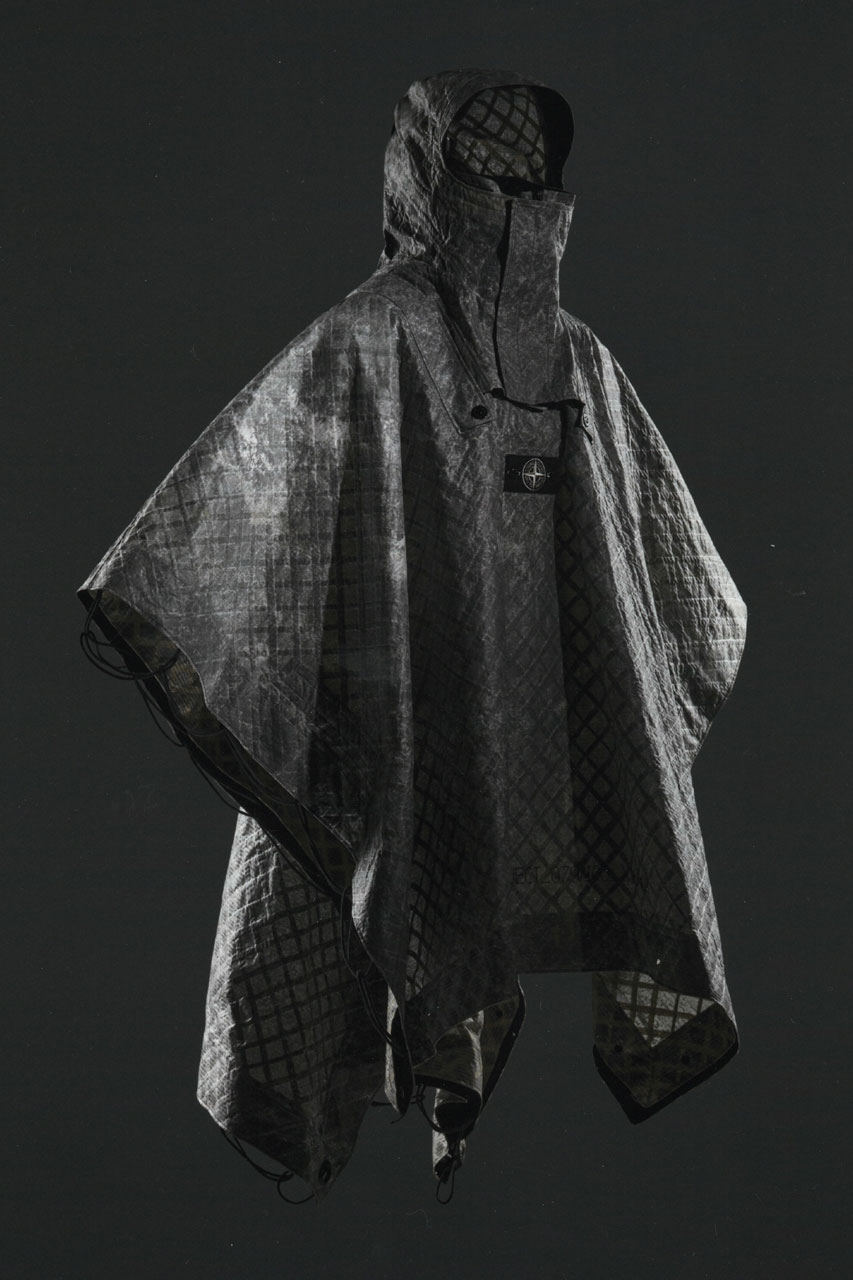 Stone Island Presents Military-Inspired Cape for Prototype Research Series_08 milan design week on display capsule collection design experimental label fabric multiaxial linen textile base as a natural reinforcement material, subsequent needle-cohesion to a non-woven fabric veil, state-of-the-art inkjet printing with pigments and double lamination of aliphatic polyurethane film. garments clothing fashion 